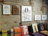 Corten and white aluminum laser cut wall sculpture for bookshop decor
